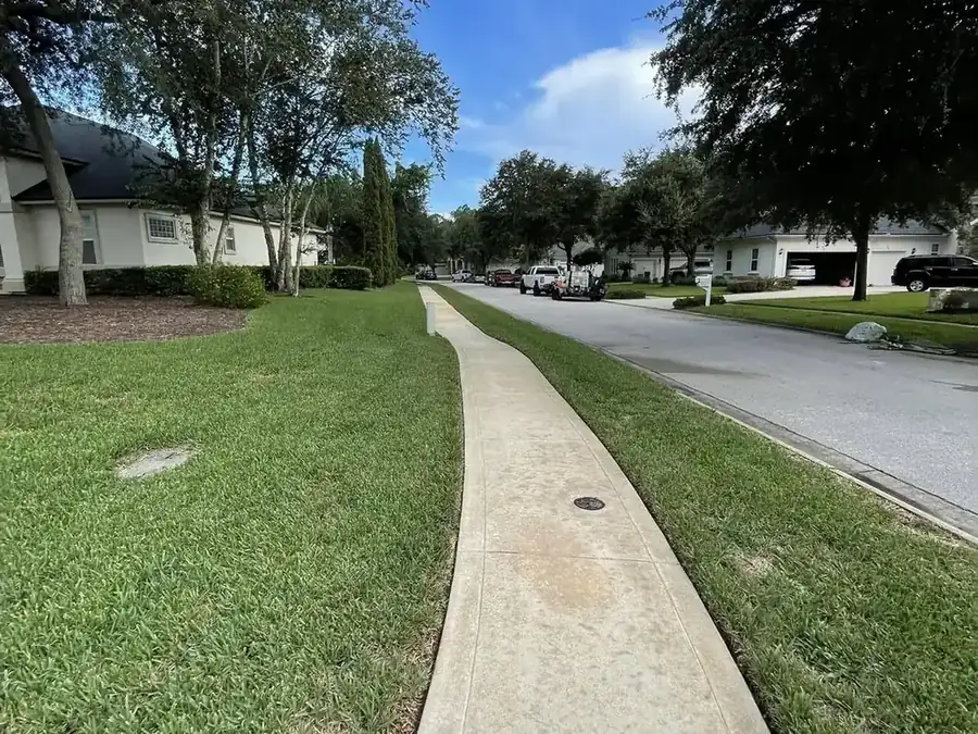 Cleaned residential sidewalk running past homes in a St. Johns County neighborhood