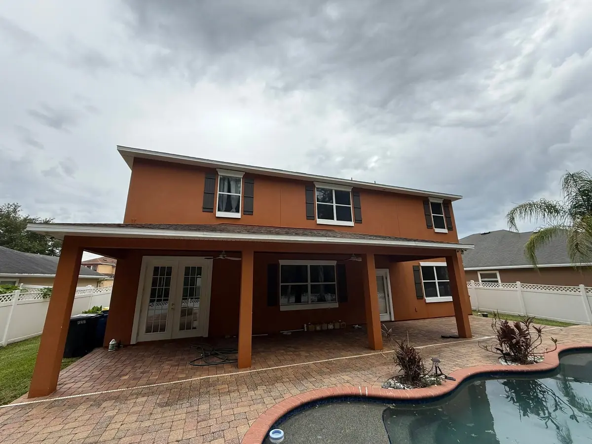 Paver pool deck and covered lanai after pressure washing at a St. Augustine home